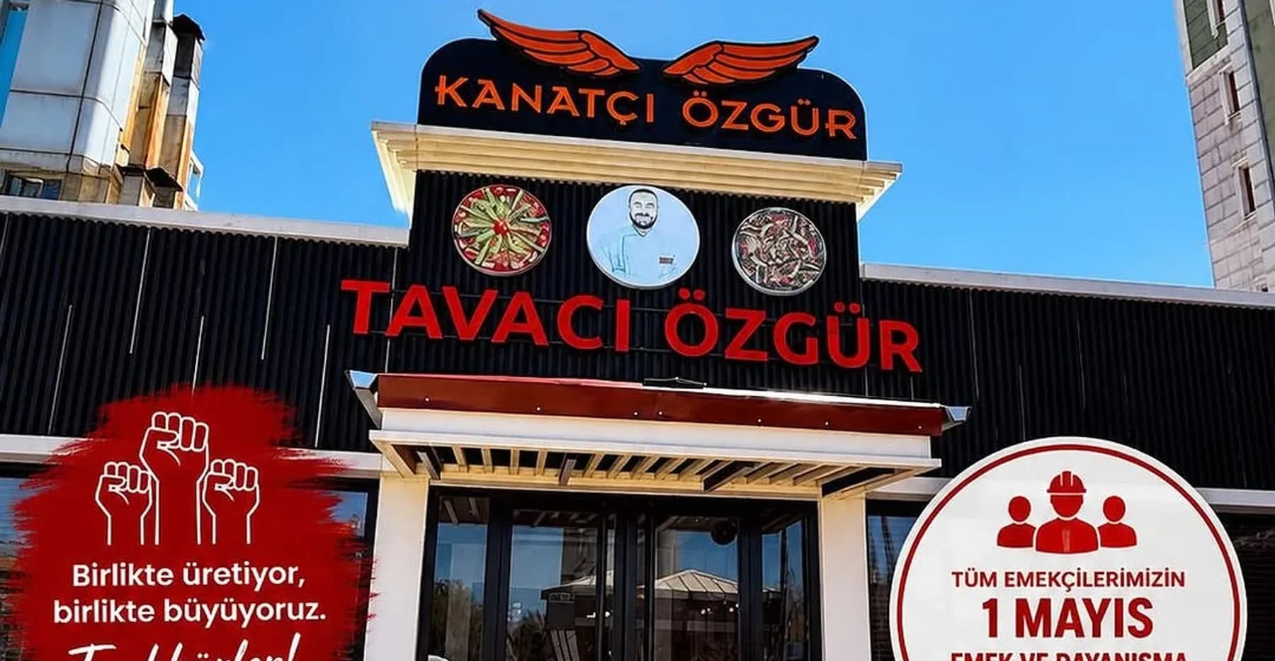 Tavacı Özgür binasının cephesi — üstte kanatlı Kanatçı Özgür tabelası, altında kırmızı harflerle Tavacı Özgür